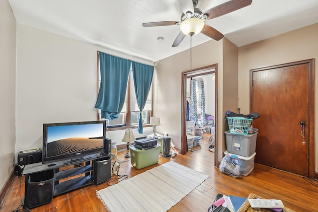 interior space featuring ceiling fan and hardwood / wood-style flooring