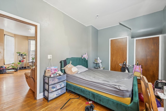 bedroom with hardwood / wood-style floors