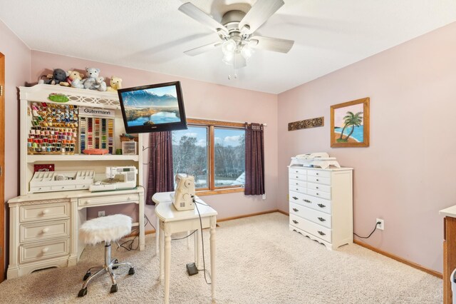 home office with ceiling fan and light colored carpet