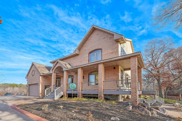 view of front of property with a garage and a porch