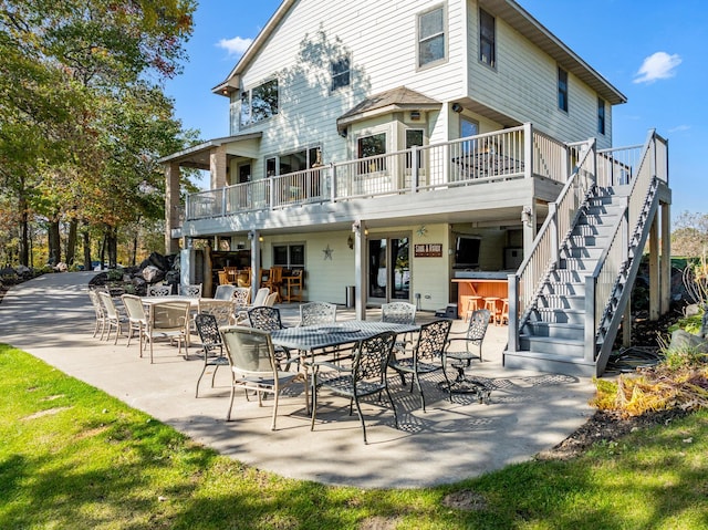 back of property featuring an outdoor bar and a patio