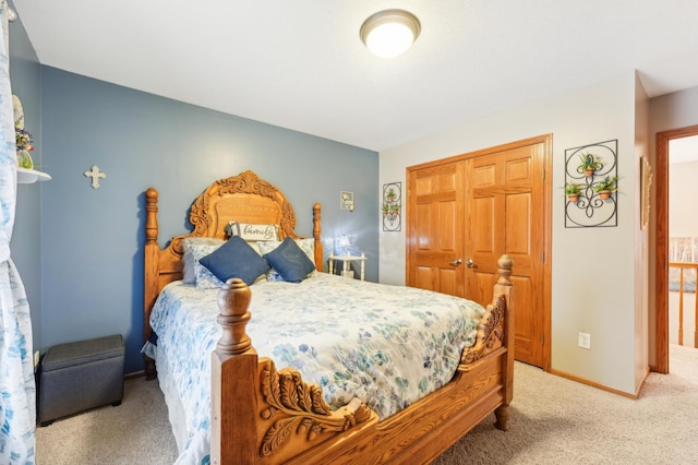 bedroom with light colored carpet and a closet