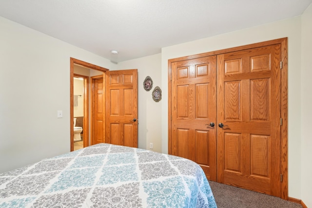 bedroom with a closet and carpet flooring