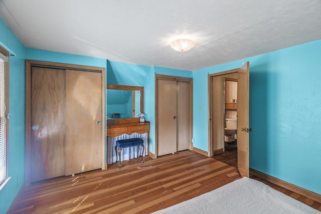 bedroom featuring dark wood-type flooring