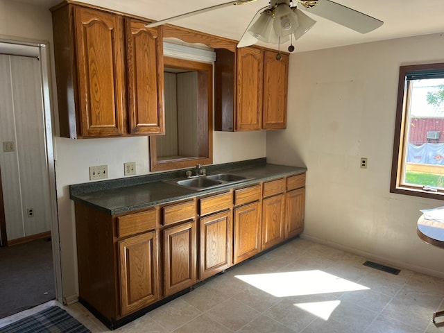 kitchen with ceiling fan and sink