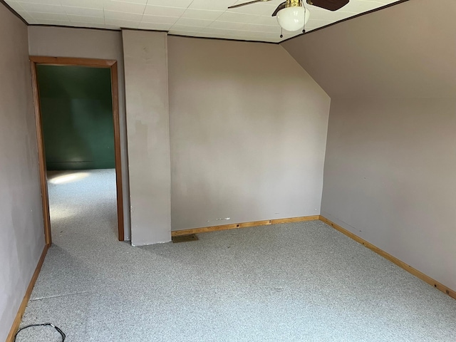 spare room featuring ceiling fan and vaulted ceiling