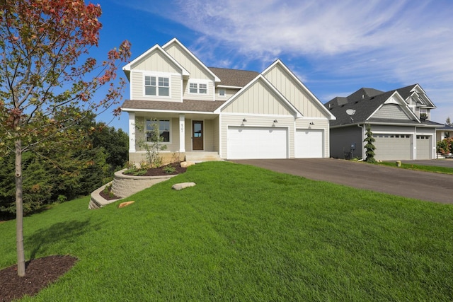 craftsman-style home featuring a garage, a front lawn, and covered porch