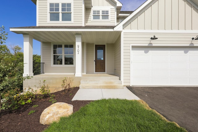 view of front of house with a porch and a garage