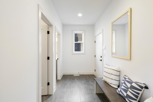 hall with dark hardwood / wood-style floors