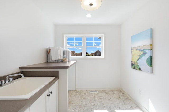 laundry area with sink