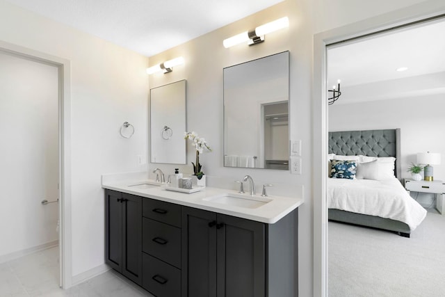 bathroom with a notable chandelier and vanity