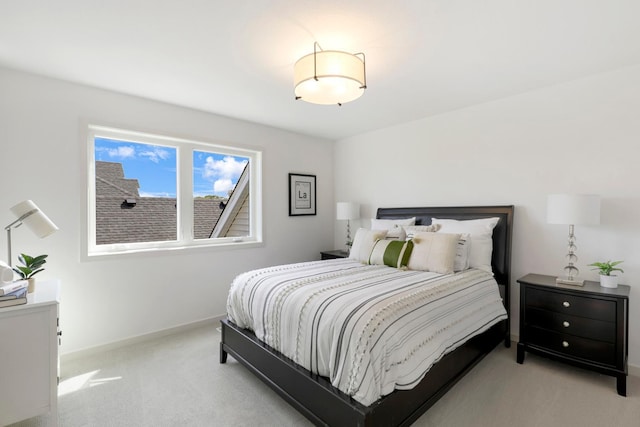 bedroom featuring light colored carpet