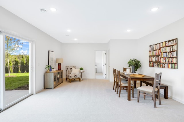 dining area with light colored carpet