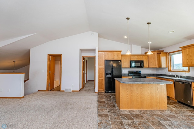 kitchen with hanging light fixtures, black appliances, lofted ceiling, a center island, and dark colored carpet