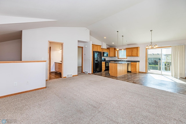 kitchen with dark carpet, a center island, lofted ceiling, black appliances, and decorative light fixtures