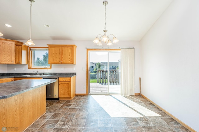 kitchen featuring an inviting chandelier, dishwasher, and decorative light fixtures