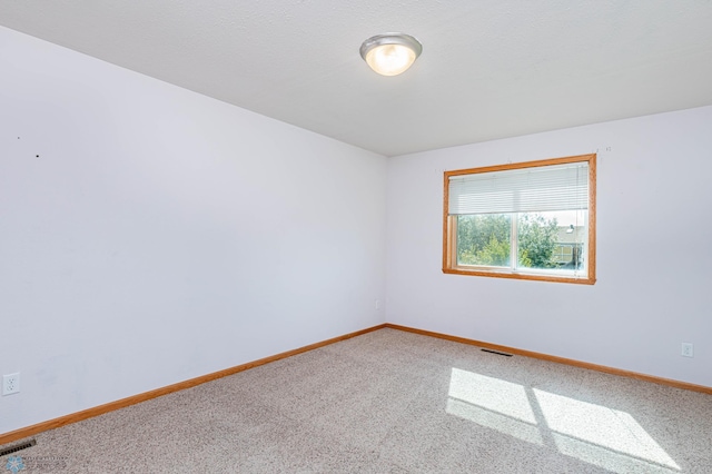 empty room featuring carpet floors