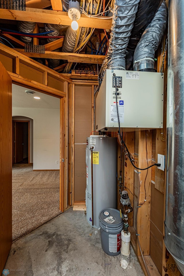 utility room with water heater