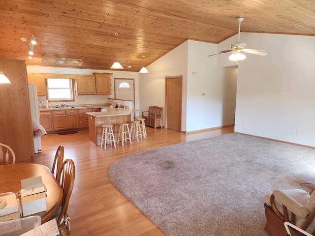 dining room featuring ceiling fan, lofted ceiling, and wood ceiling