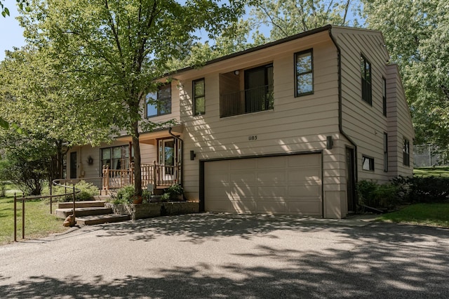 view of front of property featuring a garage and a porch