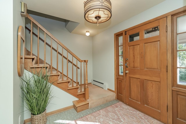 carpeted foyer featuring baseboard heating