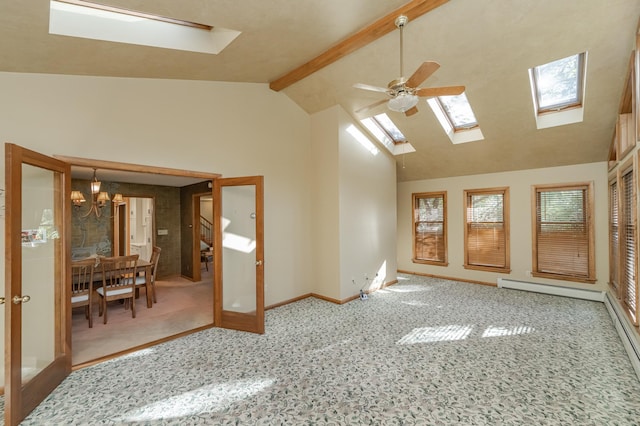 unfurnished room featuring a skylight, beam ceiling, a baseboard heating unit, high vaulted ceiling, and ceiling fan with notable chandelier