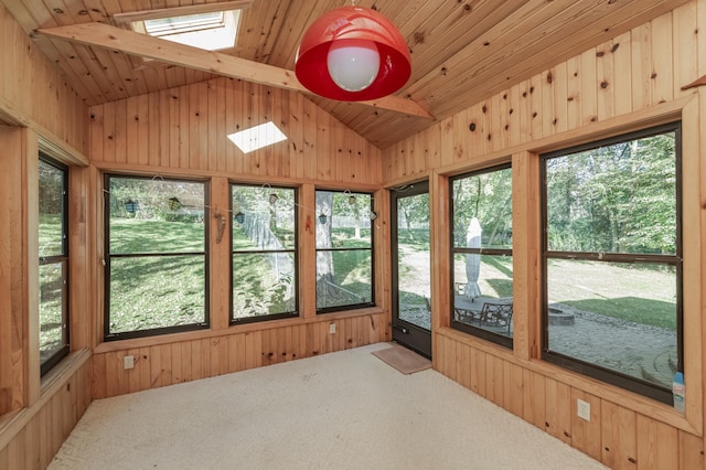 unfurnished sunroom with wooden ceiling and lofted ceiling with skylight