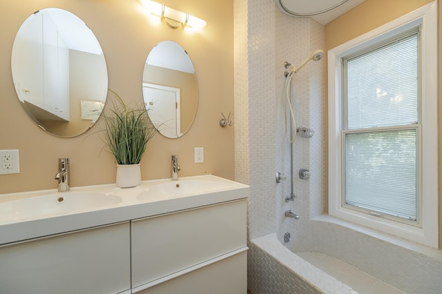 bathroom featuring shower / washtub combination and vanity