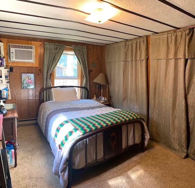 bedroom featuring a wall mounted air conditioner, wooden walls, a textured ceiling, a baseboard radiator, and carpet floors