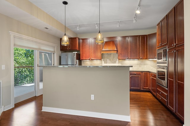 kitchen featuring light stone countertops, stainless steel appliances, a kitchen island, and dark hardwood / wood-style flooring