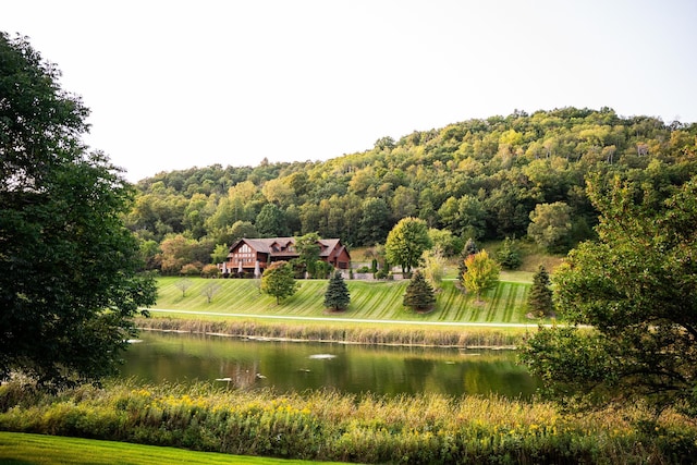 view of home's community with a water view and a rural view