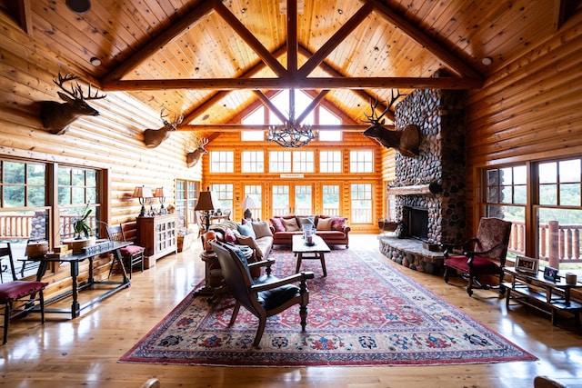 living room with wood-type flooring, a stone fireplace, rustic walls, and high vaulted ceiling