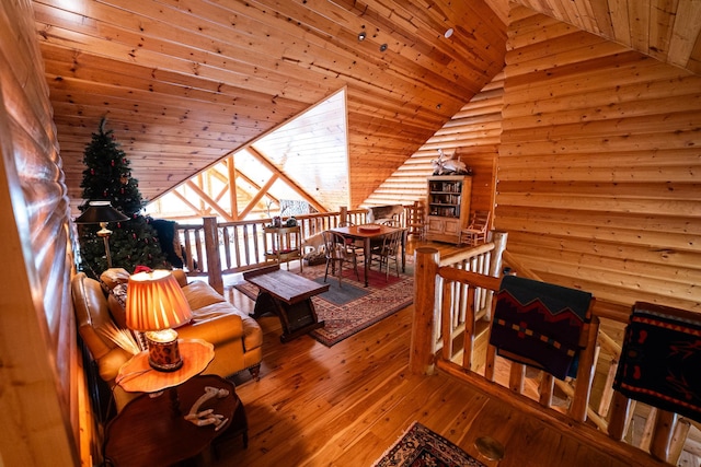 sitting room featuring wood-type flooring, wood ceiling, and lofted ceiling with skylight