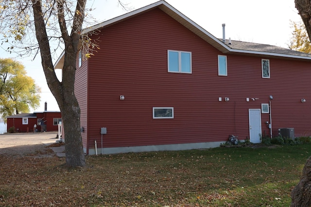 view of side of property with a yard