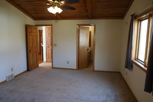 unfurnished bedroom featuring wood ceiling, multiple windows, and ceiling fan