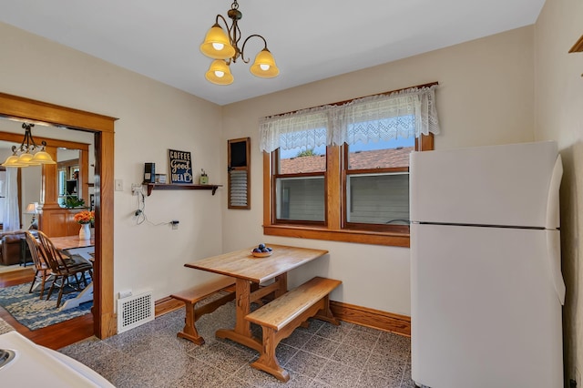 dining room featuring a chandelier