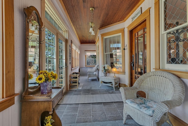 sunroom / solarium featuring wooden ceiling