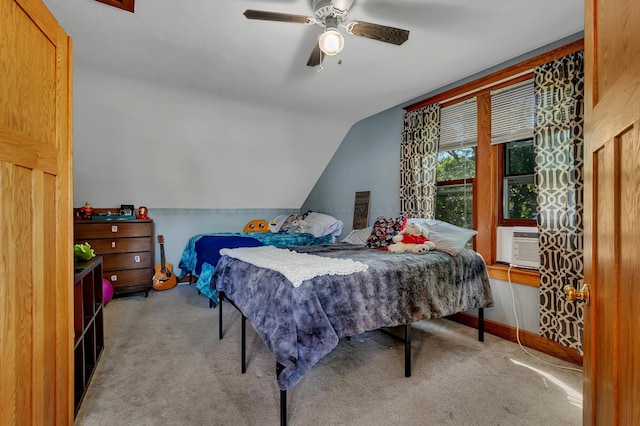 carpeted bedroom featuring cooling unit, lofted ceiling, and ceiling fan