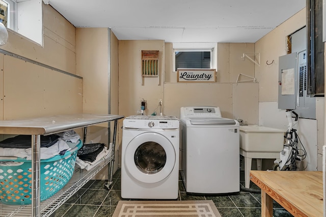 laundry area featuring separate washer and dryer, sink, and electric panel