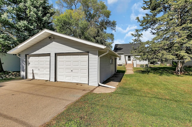 garage featuring a yard