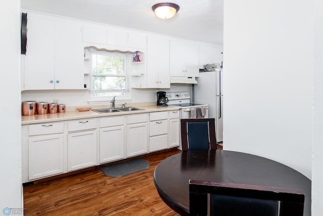 kitchen featuring dark hardwood / wood-style flooring, white cabinets, white appliances, and sink