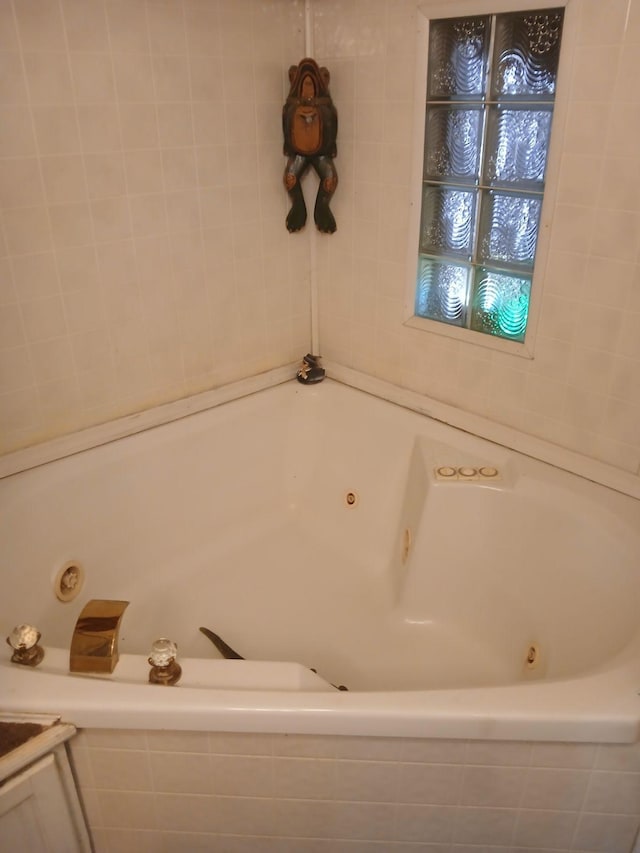 bathroom with tiled bath