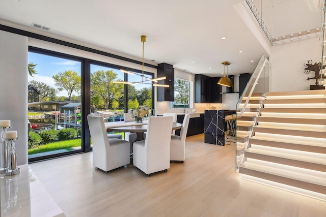 dining room featuring stairs, recessed lighting, visible vents, and light wood-style flooring