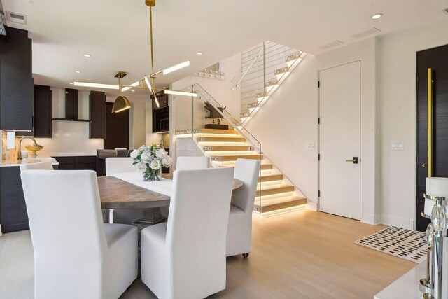 dining space with light hardwood / wood-style flooring