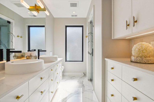 full bathroom with double vanity, visible vents, a sink, baseboards, and marble finish floor