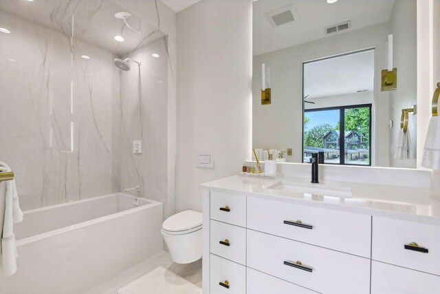 full bathroom with tub / shower combination, vanity, and toilet