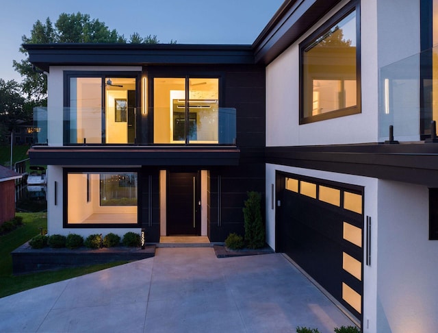 modern home featuring stucco siding and a garage