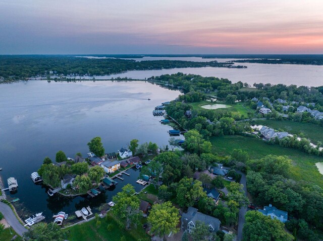 aerial view at dusk with a water view