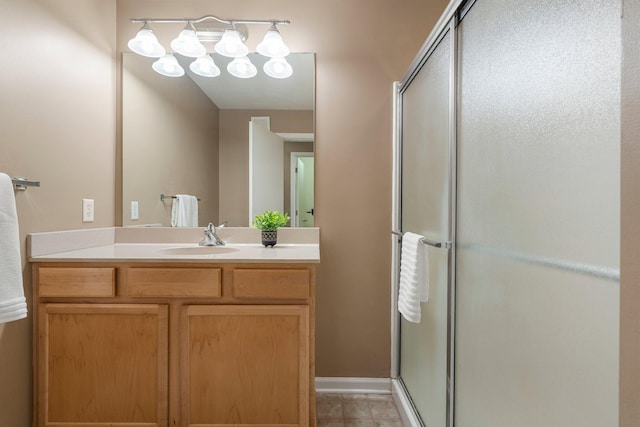 full bath with a stall shower and vanity