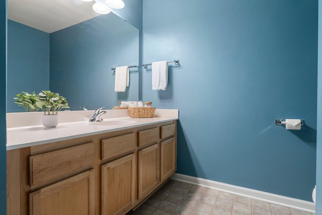 bathroom featuring vanity and baseboards